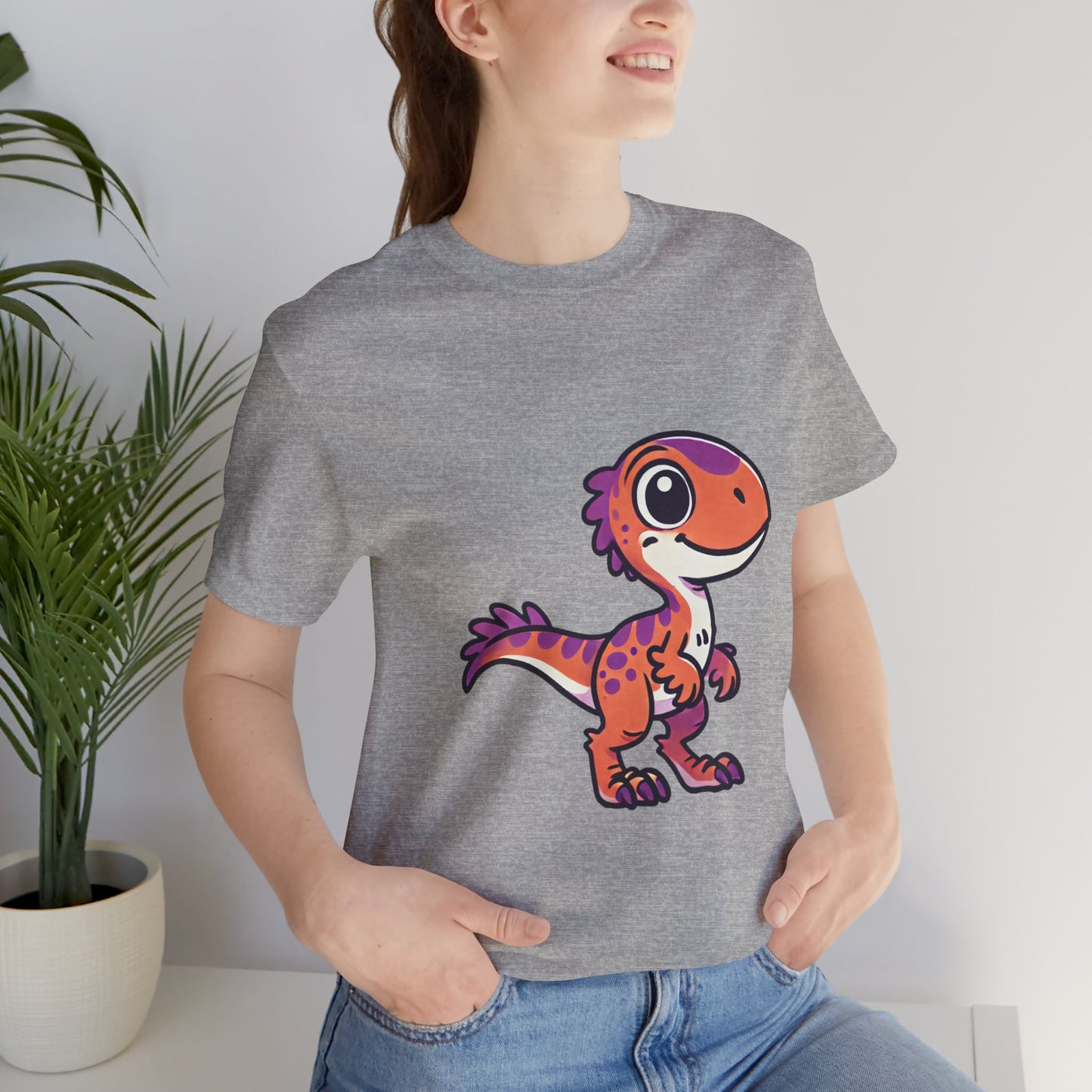 Adorable Cartoon Velociraptor Tee – Cute Dino Fun for All Ages! 🦖💜🧡 - Unisex Jersey Short Sleeve Tee Super Comfy Dino T-Shirt Gift