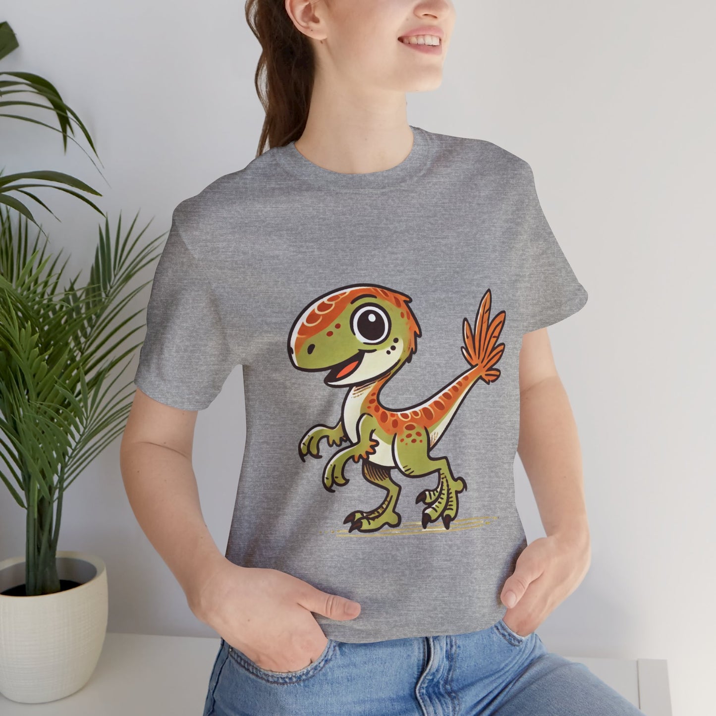 Playful Green Velociraptor Tee – Cute Dino Style with a Splash of Fun! 🦖🍂🌿 - Unisex Jersey Short Sleeve Tee Super Comfy Dino T-Shirt Gift