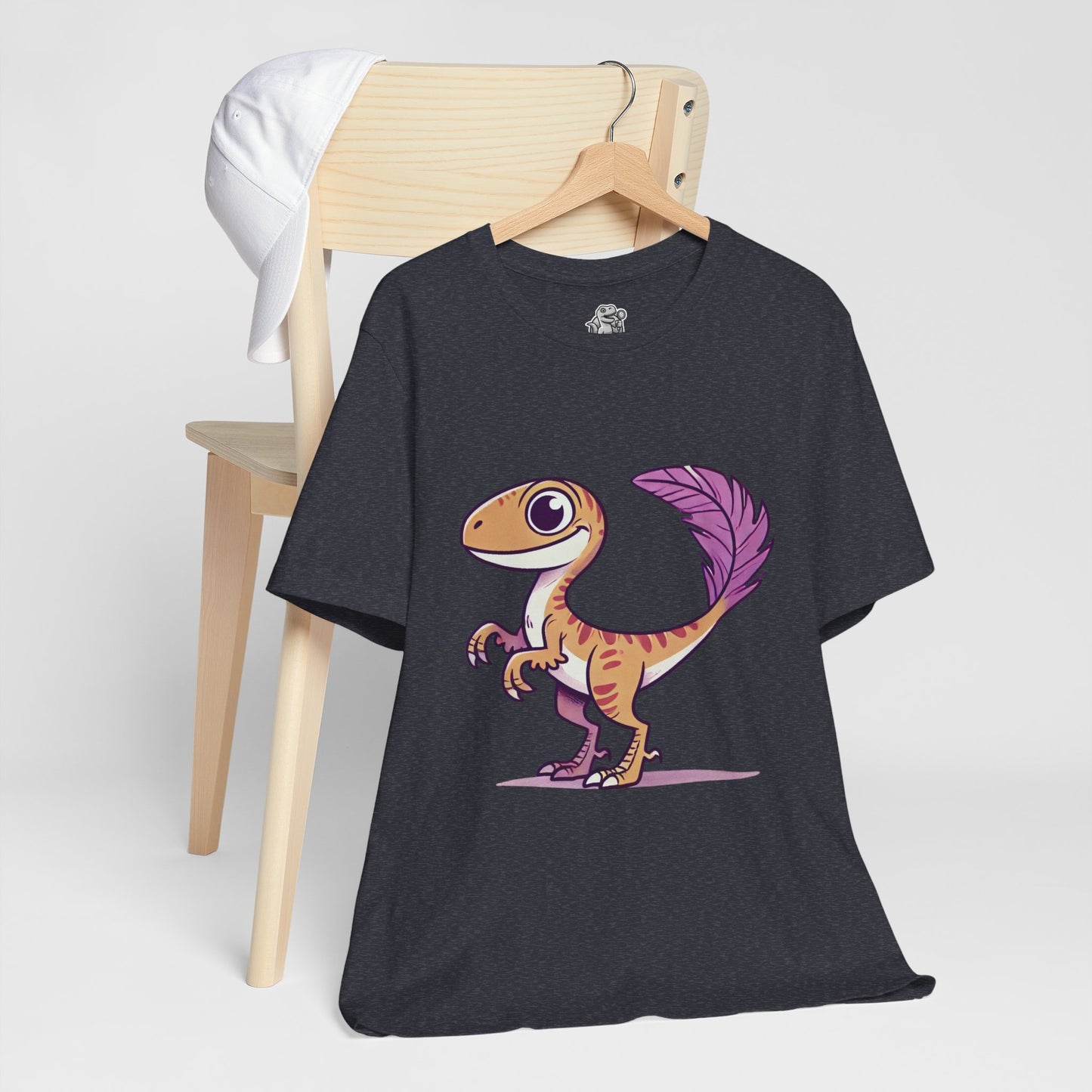 Friendly Feathered Velociraptor Tee – Cute Dino Style with a Splash of Color! 🦖💜🍃 – A Wild Splash of Style and Prehistoric Flair! 🦖💜🌿 - Unisex Jersey Short Sleeve Tee Super Comfy Dino T-Shirt Gift