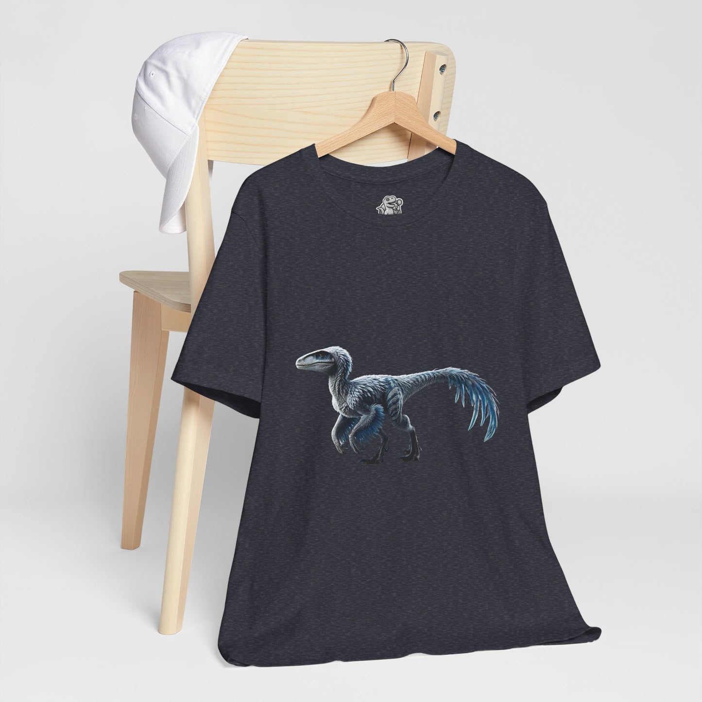 Icy Blue Feathered Velociraptor Tee – Fierce Style in Cool Tones! 🦖❄️🌌 - Unisex Jersey Short Sleeve Tee Super Comfy Dino T-Shirt Gift