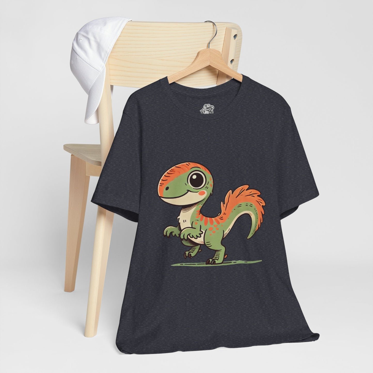 Charming Green & Orange Velociraptor Tee – Dino Delight for All Ages! 🦖🍃🧡 - Unisex Jersey Short Sleeve Tee Super Comfy Dino T-Shirt Gift