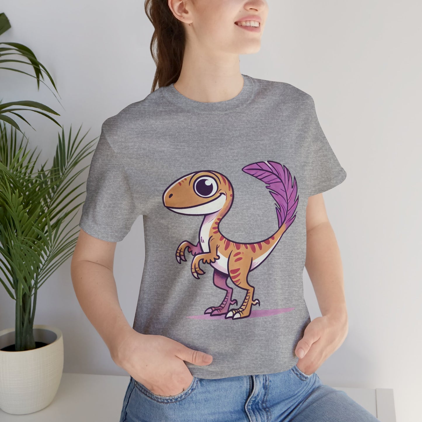 Friendly Feathered Velociraptor Tee – Cute Dino Style with a Splash of Color! 🦖💜🍃 – A Wild Splash of Style and Prehistoric Flair! 🦖💜🌿 - Unisex Jersey Short Sleeve Tee Super Comfy Dino T-Shirt Gift