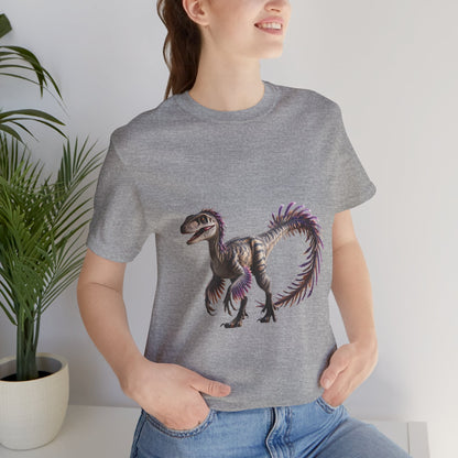 Fiercely Feathered Velociraptor Tee – A Wild Splash of Style and Prehistoric Flair! 🦖💜🌿 - Unisex Jersey Short Sleeve Tee Super Comfy Dino T-Shirt Gift