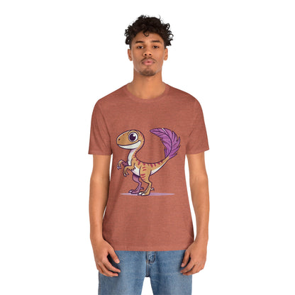 Friendly Feathered Velociraptor Tee – Cute Dino Style with a Splash of Color! 🦖💜🍃 – A Wild Splash of Style and Prehistoric Flair! 🦖💜🌿 - Unisex Jersey Short Sleeve Tee Super Comfy Dino T-Shirt Gift