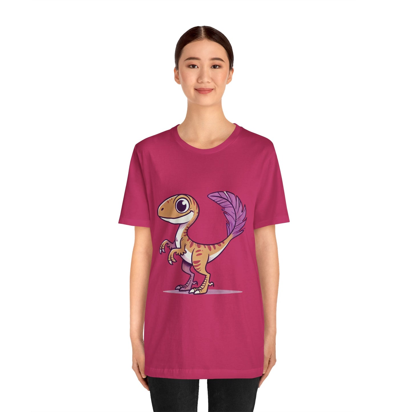 Friendly Feathered Velociraptor Tee – Cute Dino Style with a Splash of Color! 🦖💜🍃 – A Wild Splash of Style and Prehistoric Flair! 🦖💜🌿 - Unisex Jersey Short Sleeve Tee Super Comfy Dino T-Shirt Gift